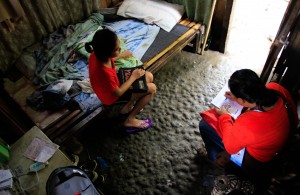 "Kwarto" is Mario Christian Micabalo's winning entry to the Listahanan Photo Contest held last this month. The photo shows how a DSWD enumerator interviews a household to be included in the data of who and where the poor are in the country. (Photo by Mario Christian Micabalo)