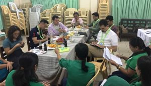 World Bank representatives discuss their findings of monitoring with the members of the Municipal Action Team of Tagoloan, Misamis Oriental while DSWD Field Office 10 Director Nestor Briones Ramos (third from left) listens.
